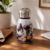 Mini Stainless Steel Water Bottle – 300 ml Floral Print (1) 300 ml mini stainless steel water bottle with colourful floral artwork and metallic carry-loop lid