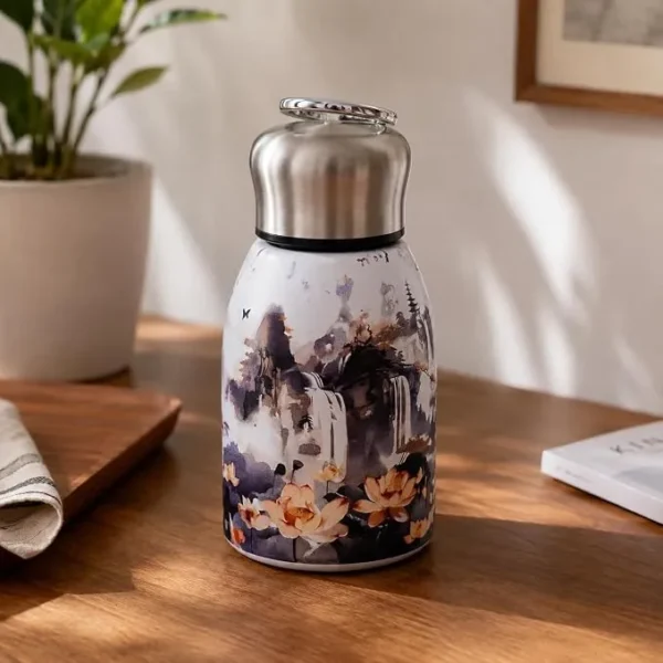 Mini Stainless Steel Water Bottle – 300 ml Floral Print (1) 300 ml mini stainless steel water bottle with colourful floral artwork and metallic carry-loop lid