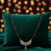 Rose gold plated mangalsutra for women with a stone-studded pendant and black-bead chain