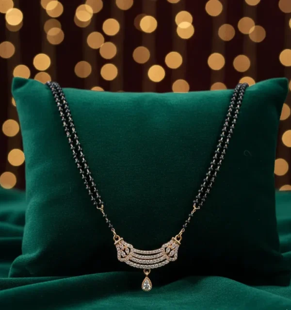 Rose Gold Plated Mangalsutra for Women Rose gold plated mangalsutra for women with a stone-studded pendant and black-bead chain